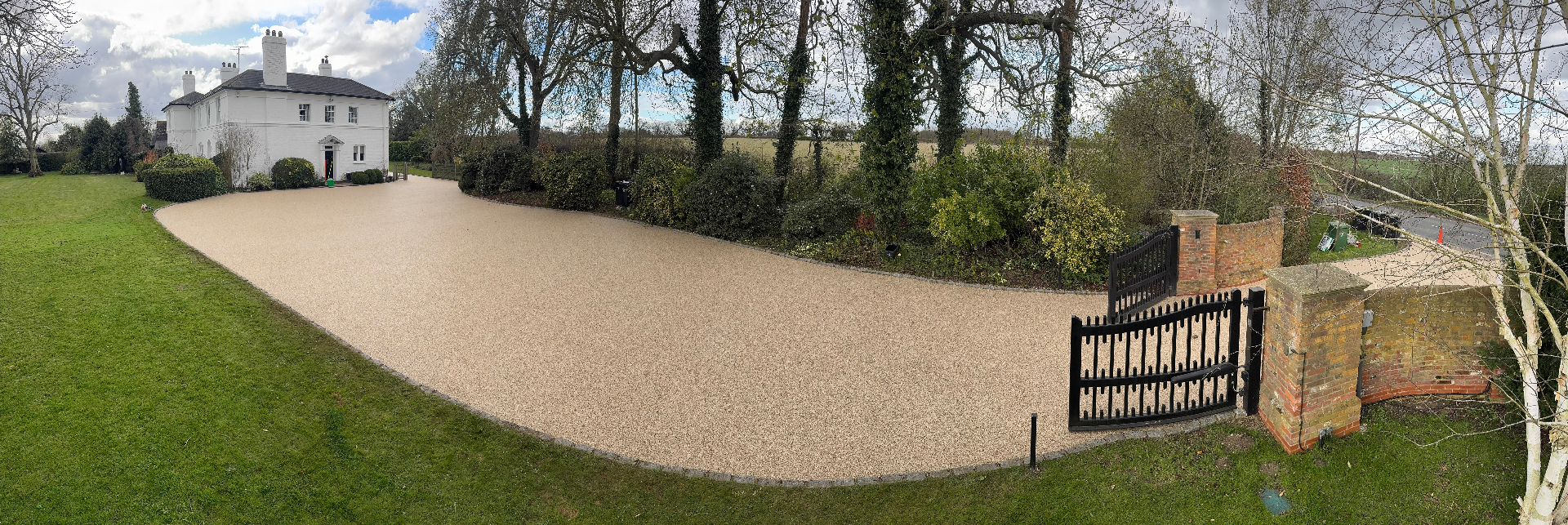 Resin bound driveway with white house